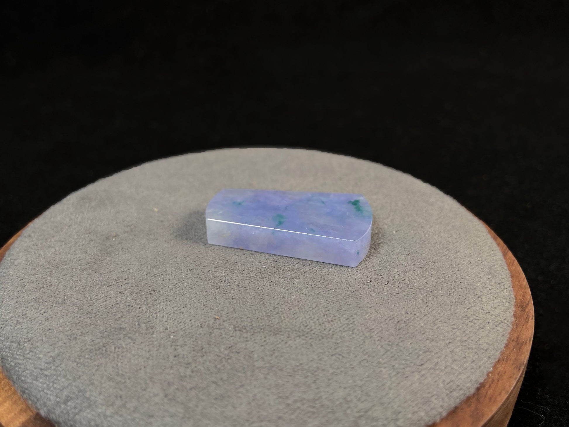 Lavender jade Wu Shi Pai with mossy green patterns.