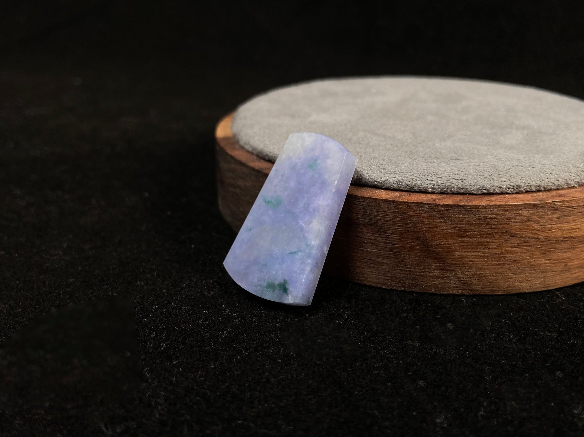 Lavender jade Wu Shi Pai with mossy green patterns.