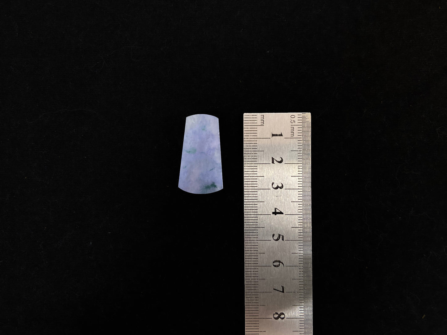 Lavender jade Wu Shi Pai with mossy green patterns.