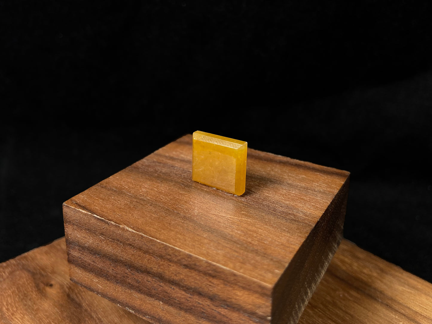 A warm yellow jadeite cut into a charming sugar cube shape.