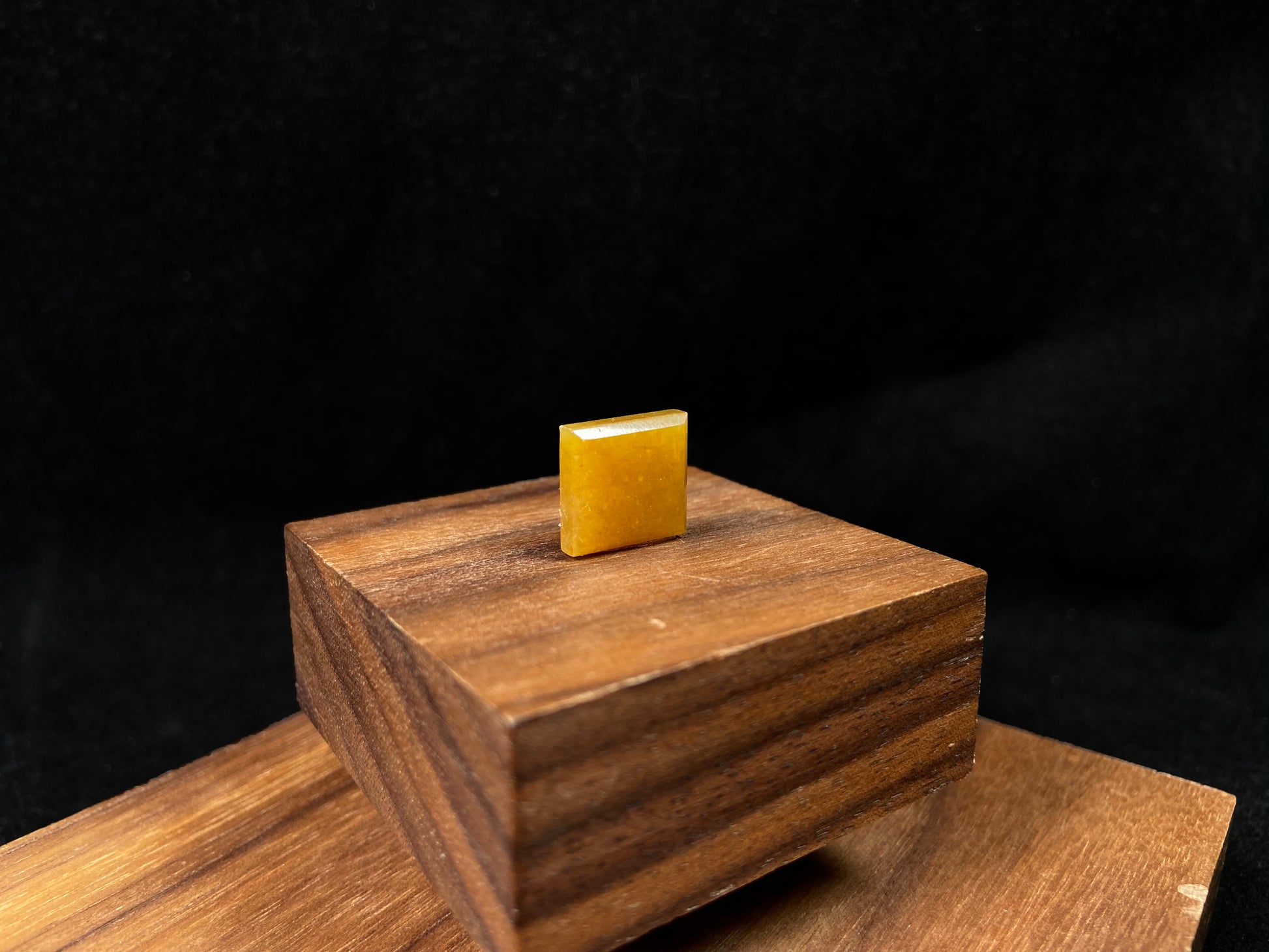 A warm yellow jadeite cut into a charming sugar cube shape.