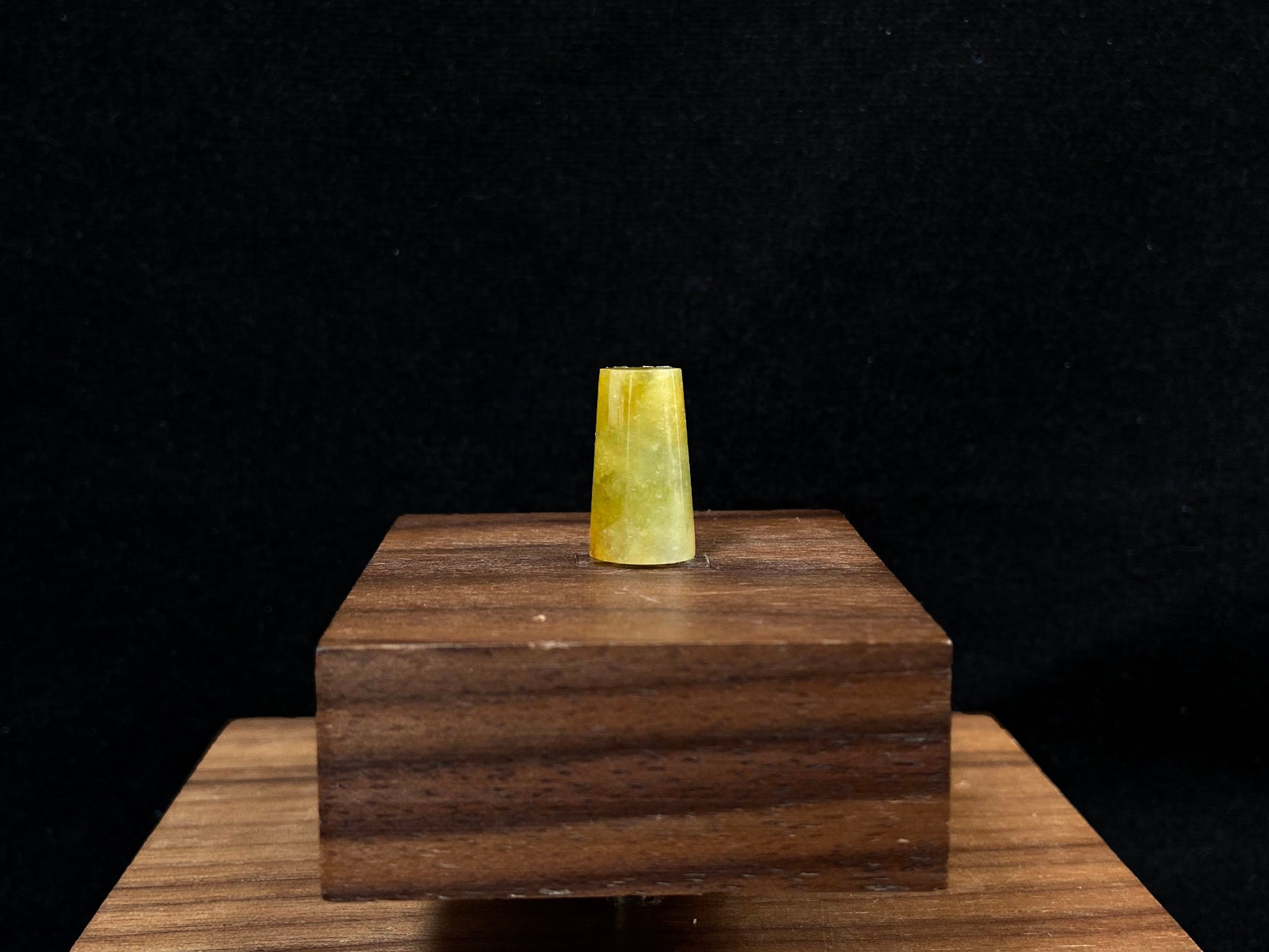 This honey colored jade features a half round shape.