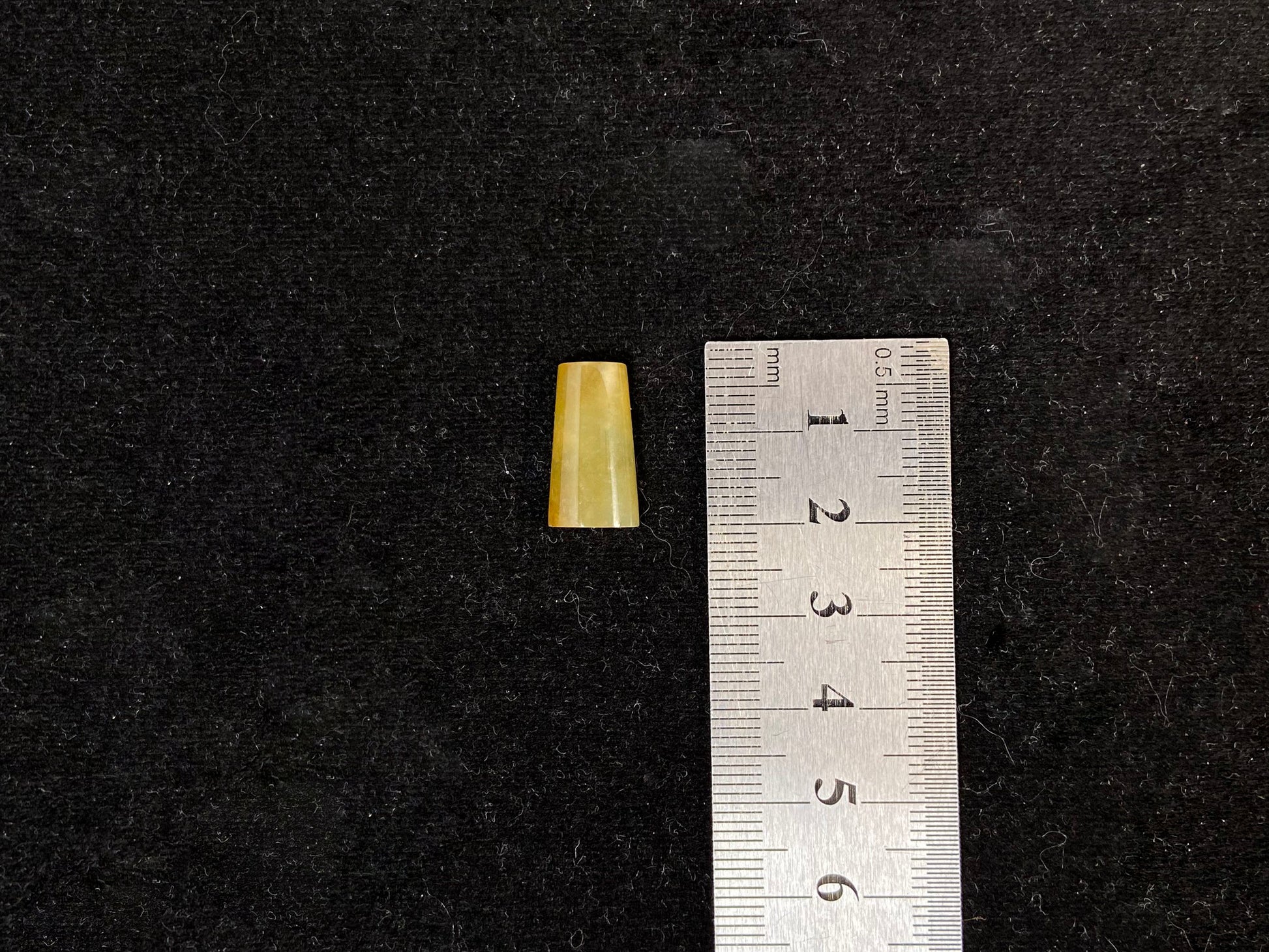 This honey colored jade features a half round shape.