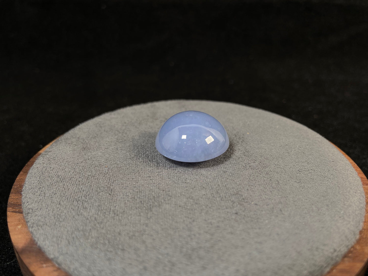 Purple jade in a perfect semi circle cut.