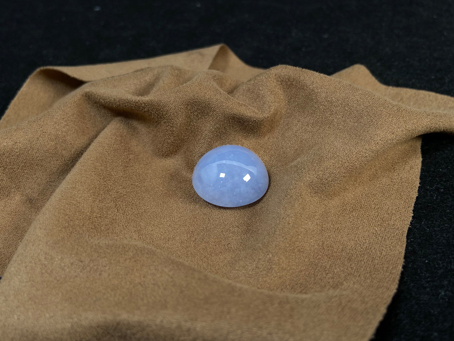 Purple jade in a perfect semi circle cut.