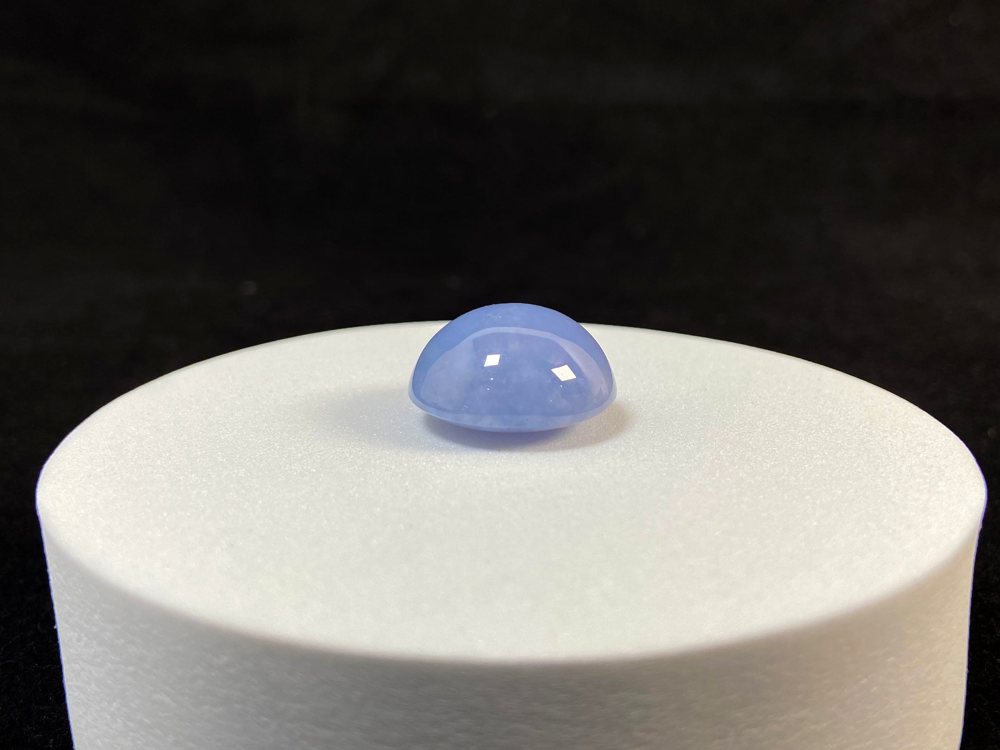 Purple jade in a perfect semi circle cut.