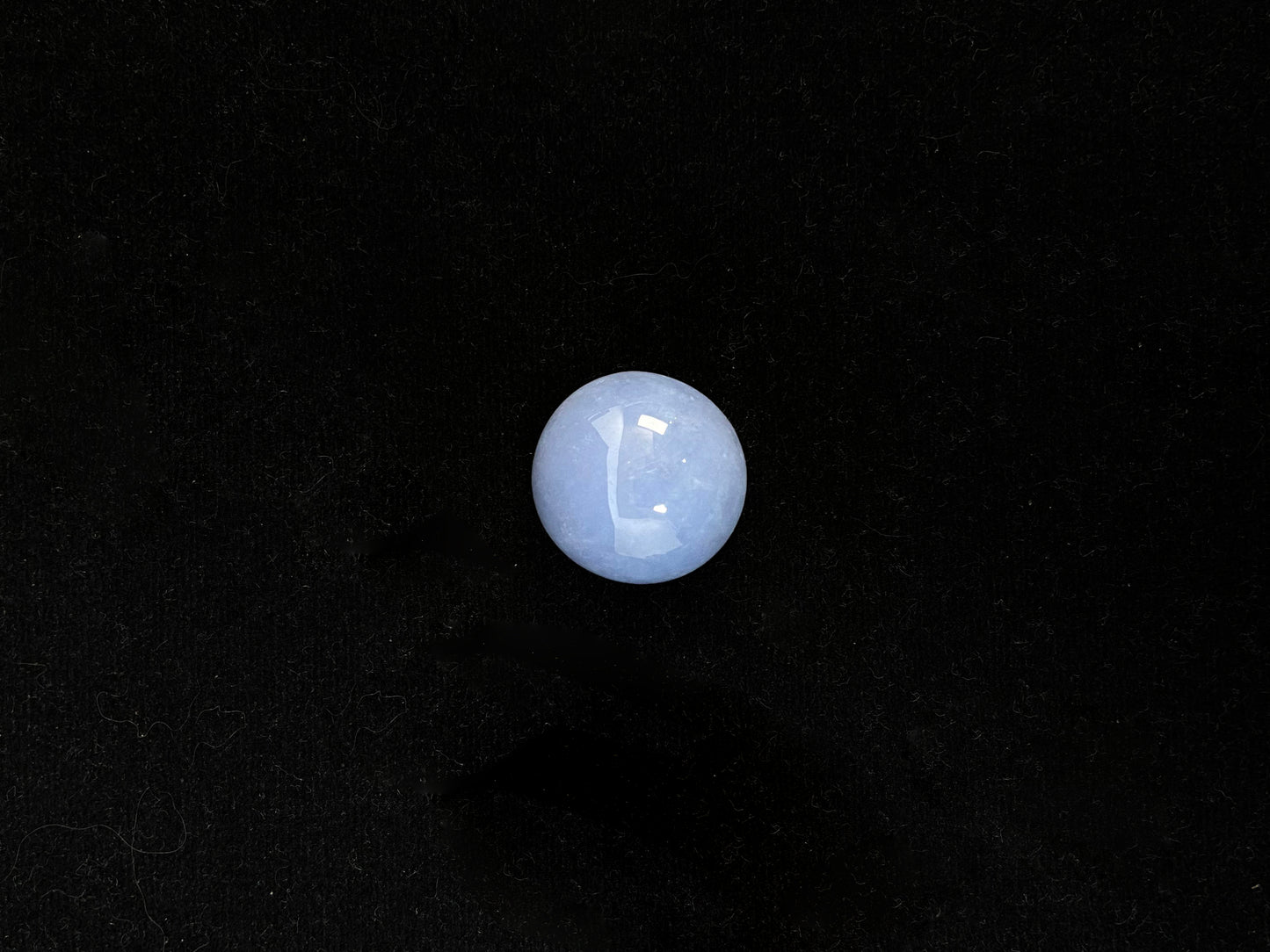 Purple jade in a perfect semi circle cut.