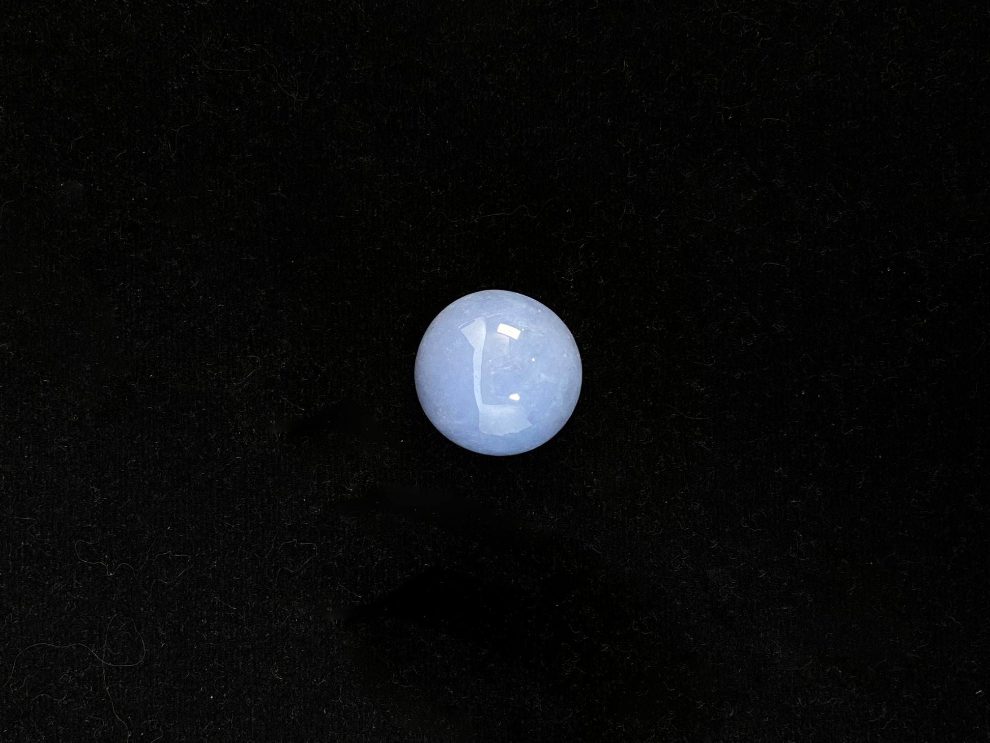 Purple jade in a perfect semi circle cut.