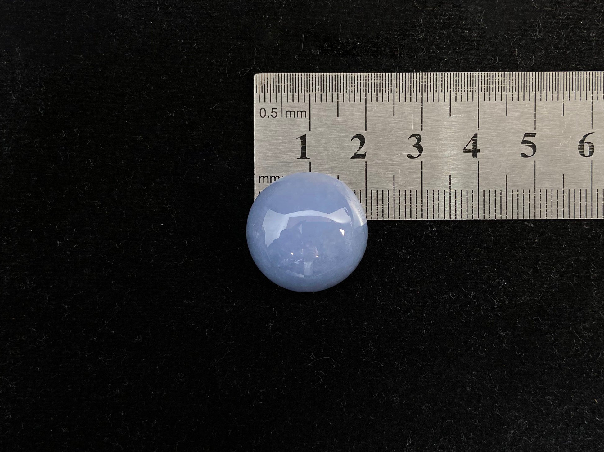 Purple jade in a perfect semi circle cut.