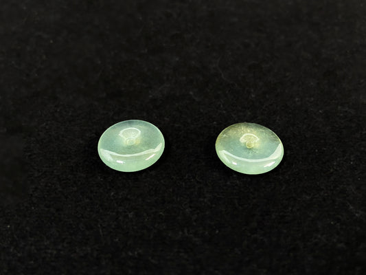 Two transparent mint green jade rounds with gold dusting.