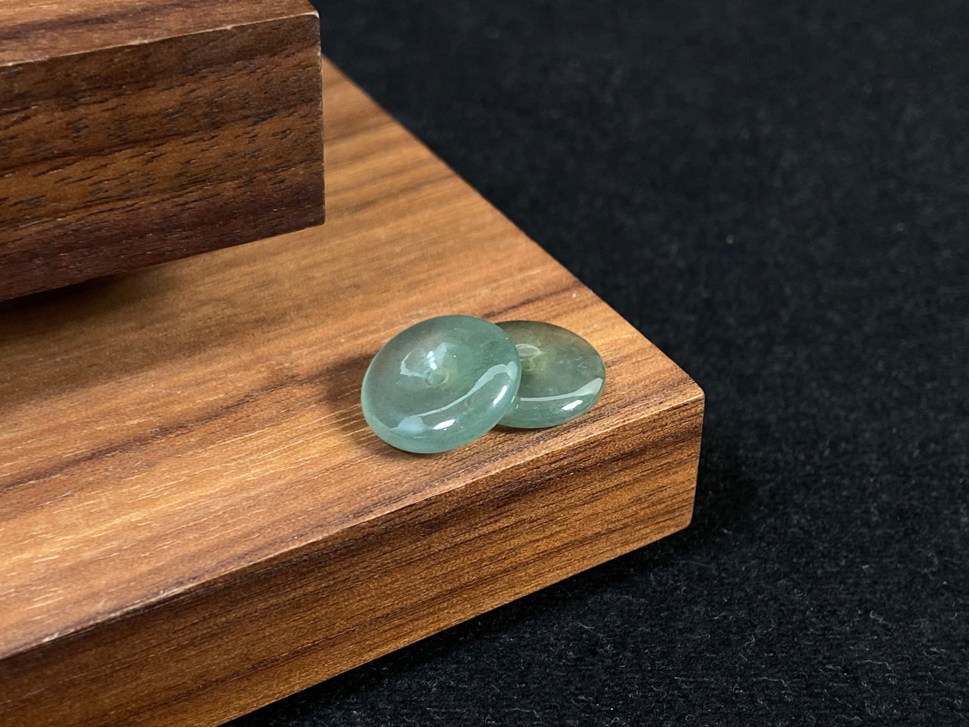 Two transparent mint green jade rounds with gold dusting.