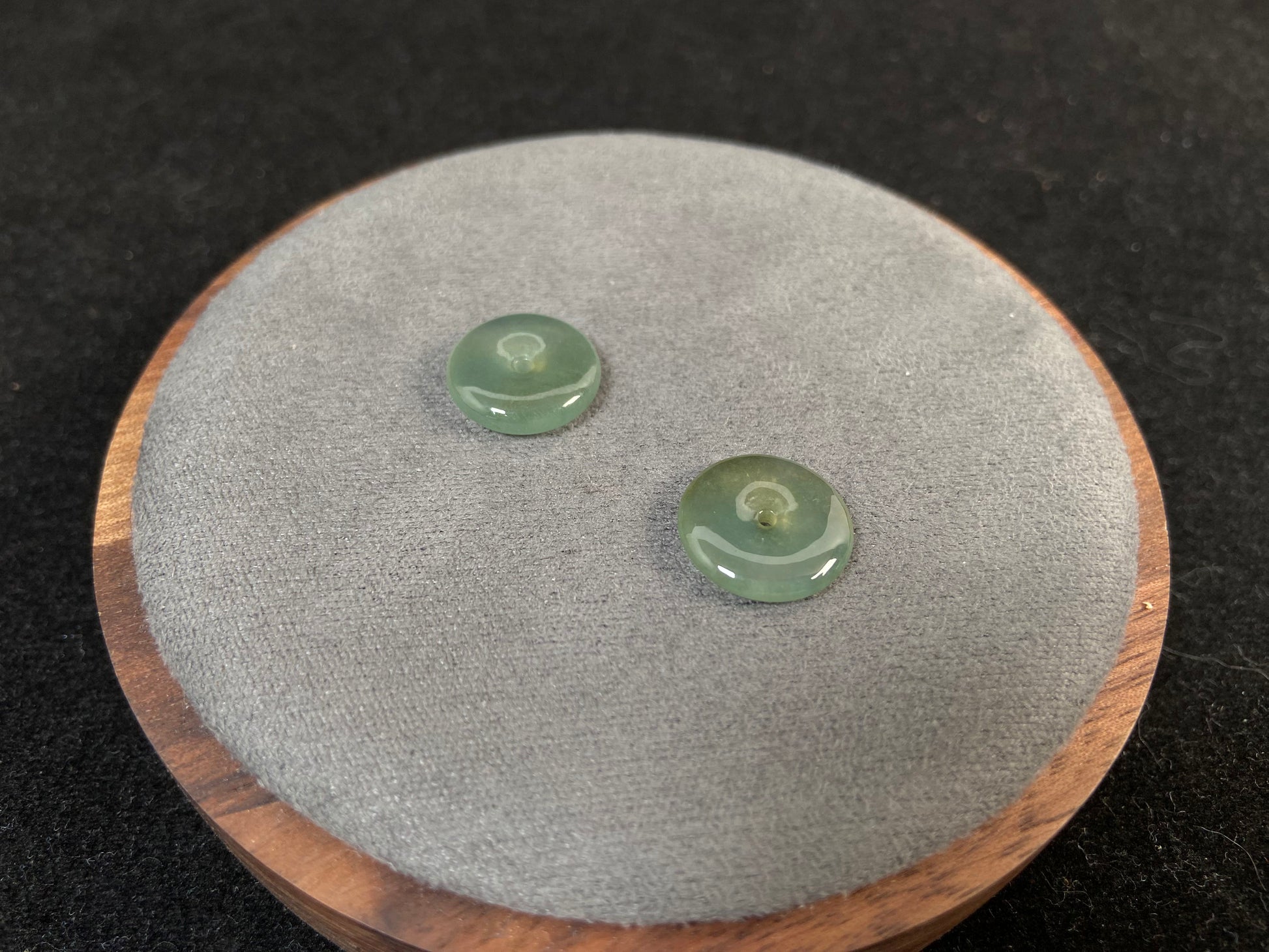 Two transparent mint green jade rounds with gold dusting.