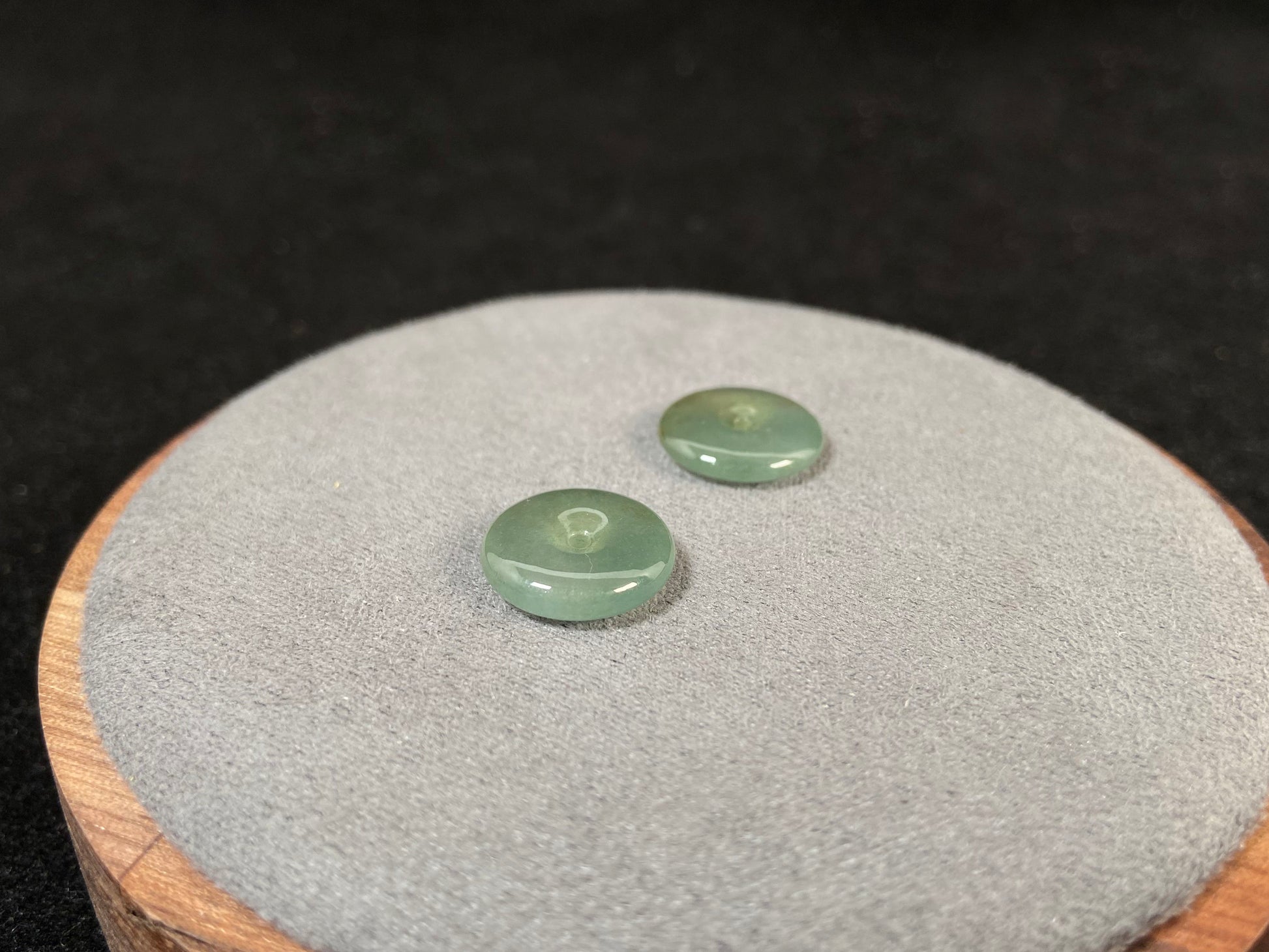 Two transparent mint green jade rounds with gold dusting.