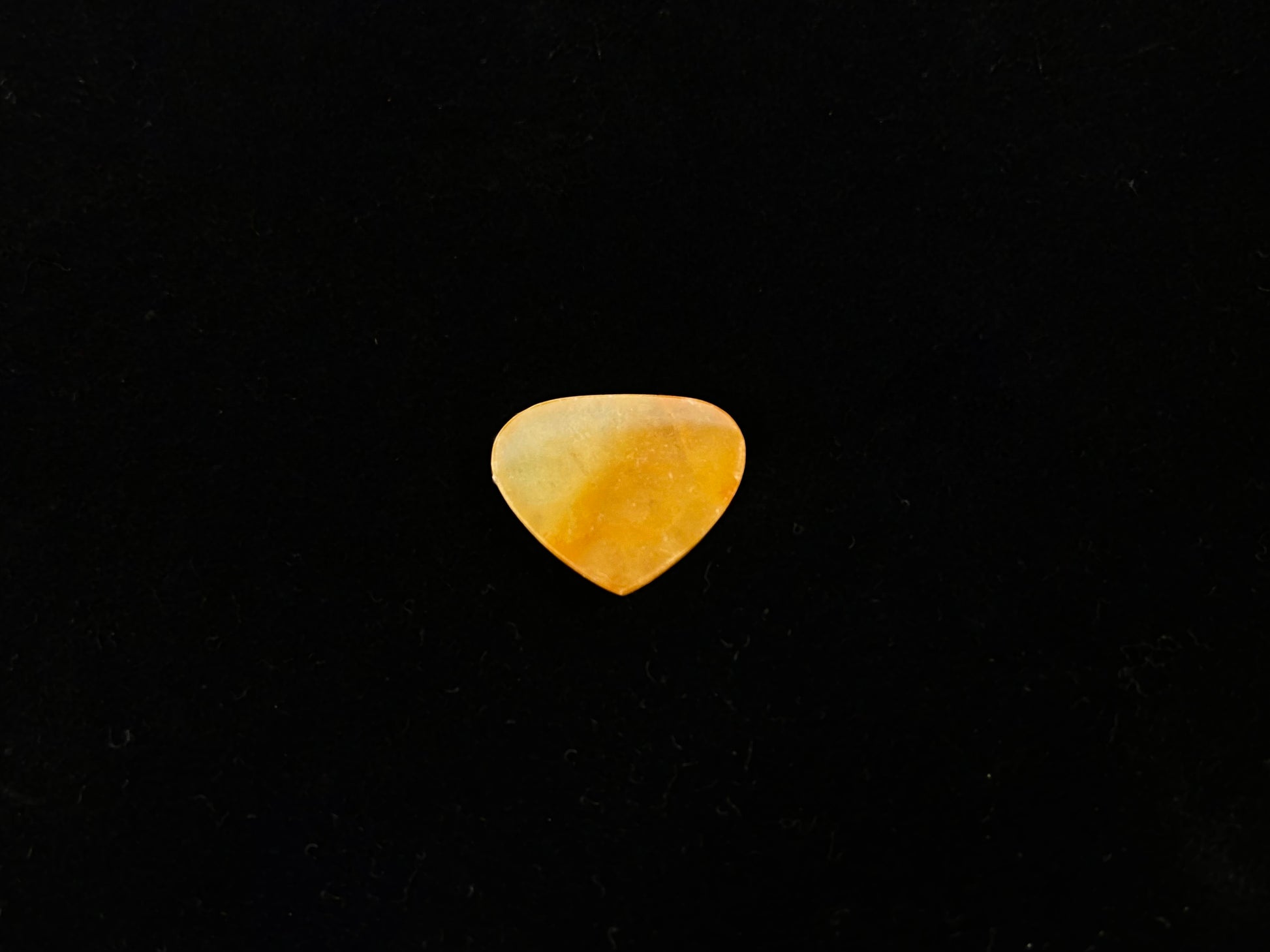 A yellow heart-shaped jadeite.