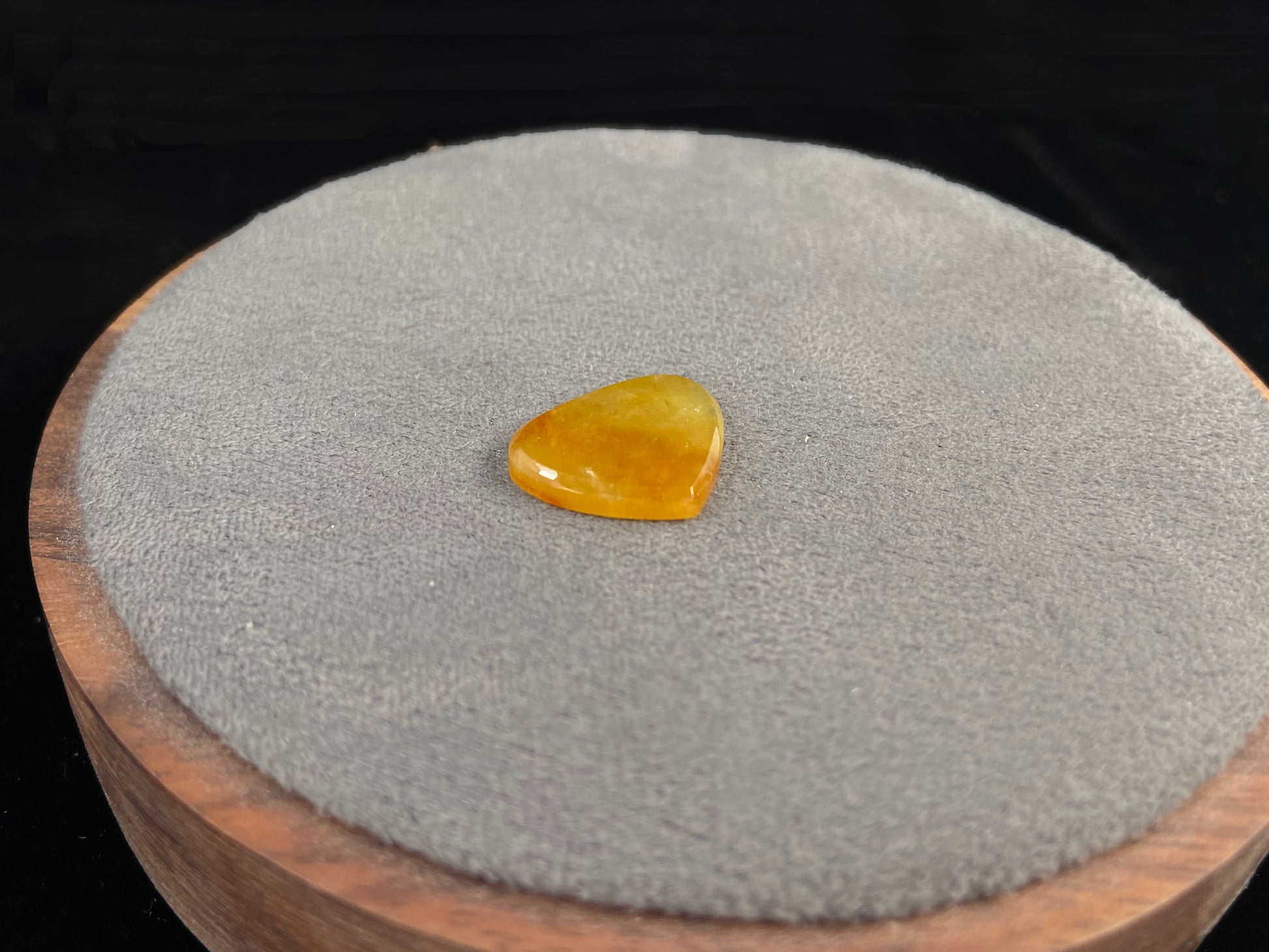 A yellow heart-shaped jadeite.