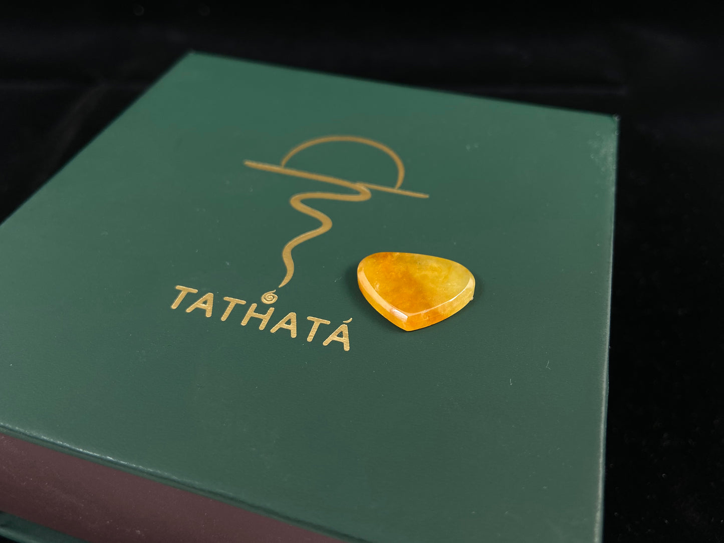 A yellow heart-shaped jadeite.