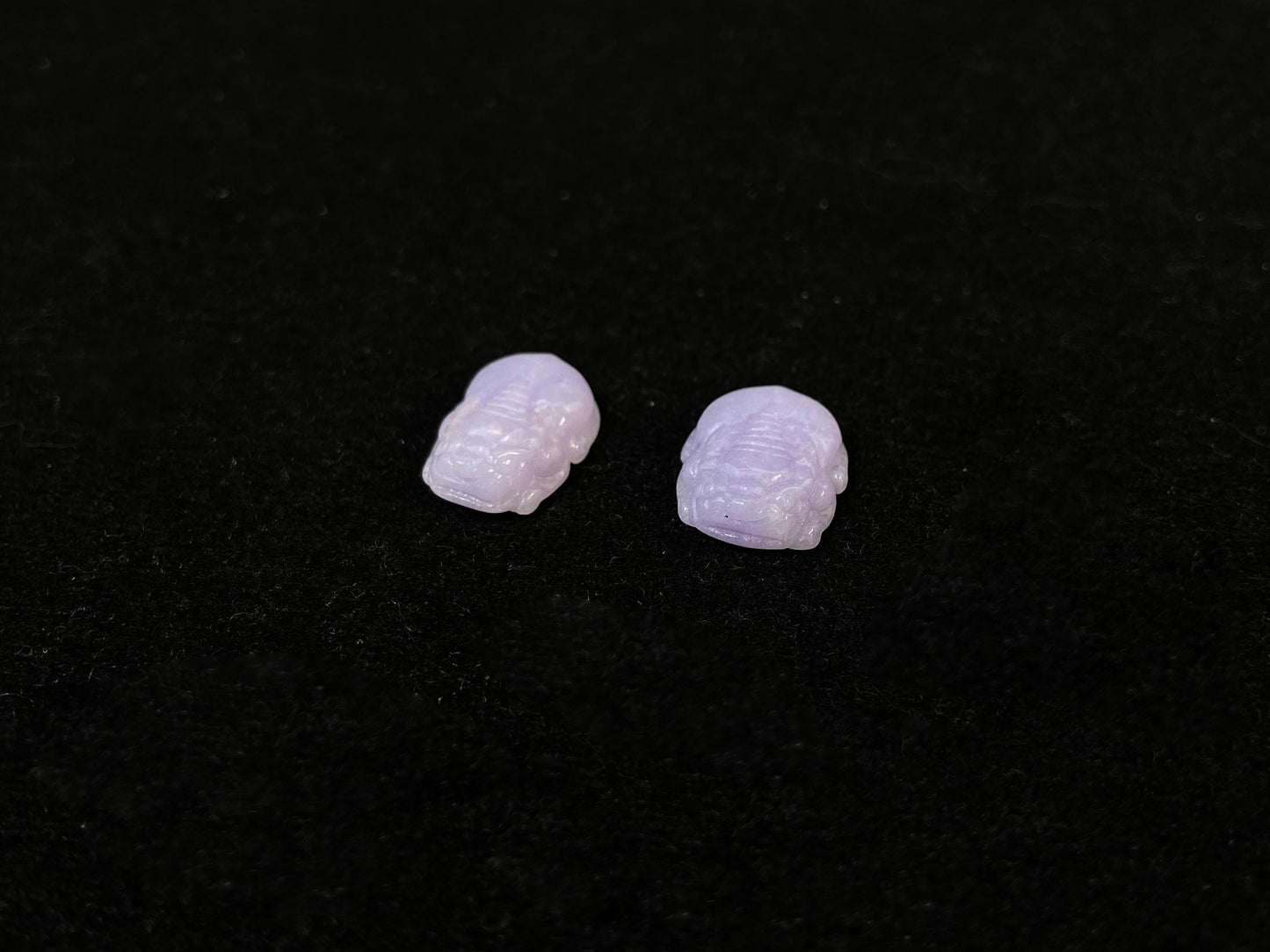 A set of two purple jade Pi Xiu figures: one plump and one slender.