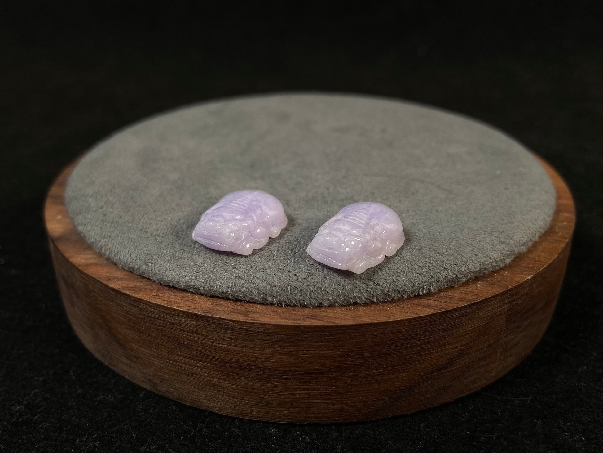 A set of two purple jade Pi Xiu figures: one plump and one slender.