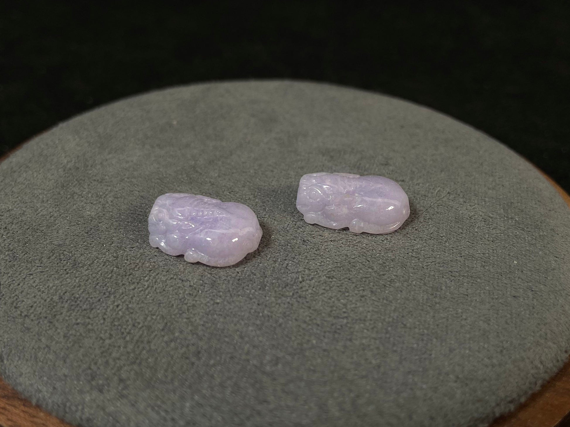 A set of two purple jade Pi Xiu figures: one plump and one slender.