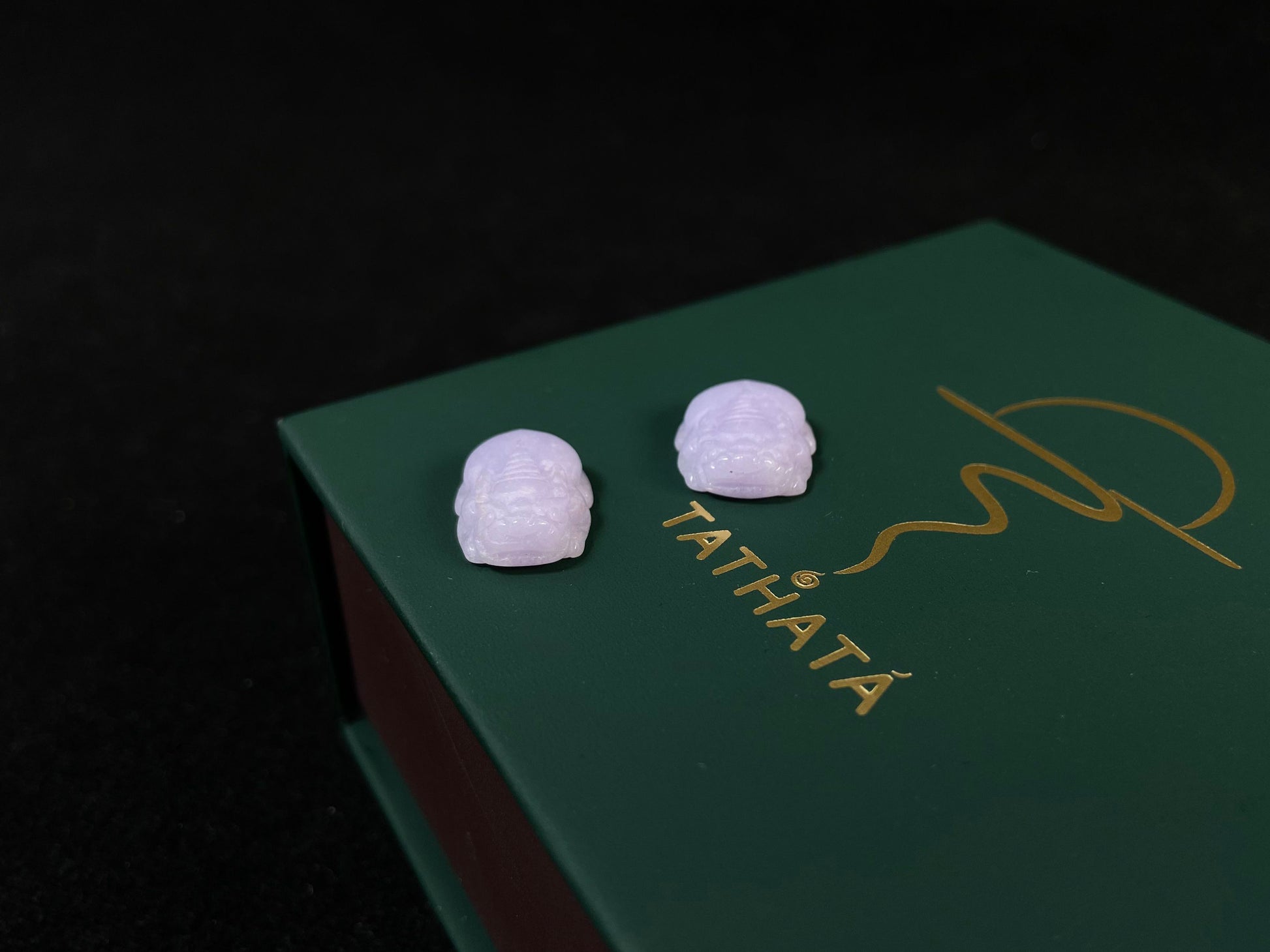 A set of two purple jade Pi Xiu figures: one plump and one slender.