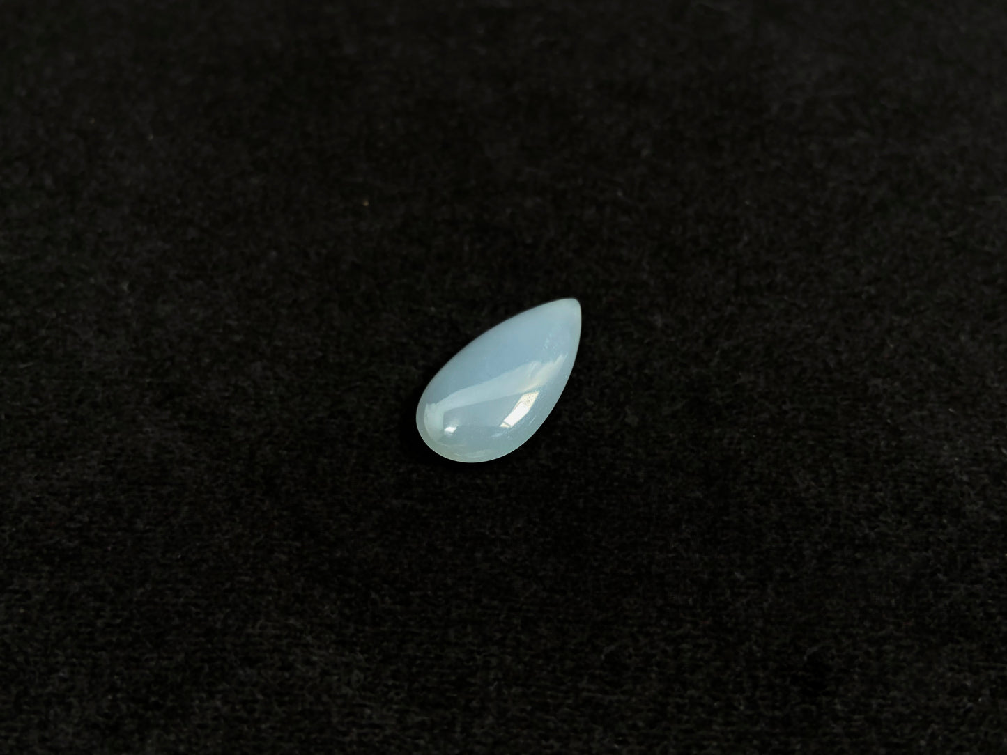 A blue, semi-transparent teardrop jadeite.
