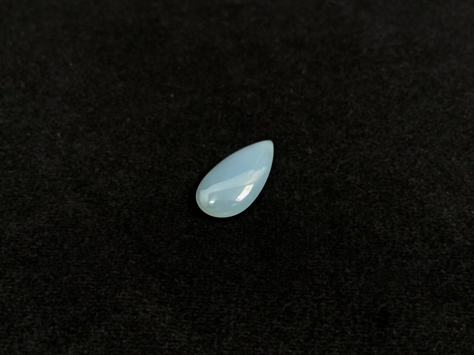 A blue, semi-transparent teardrop jadeite.
