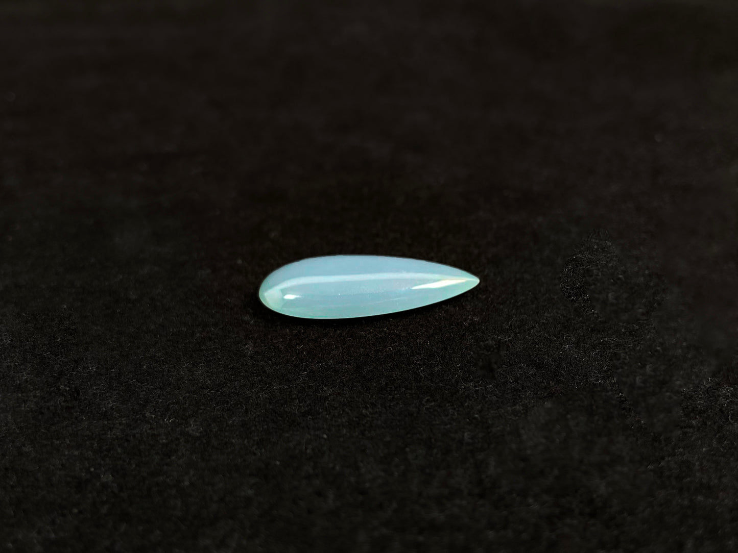 A blue, semi-transparent teardrop jadeite.
