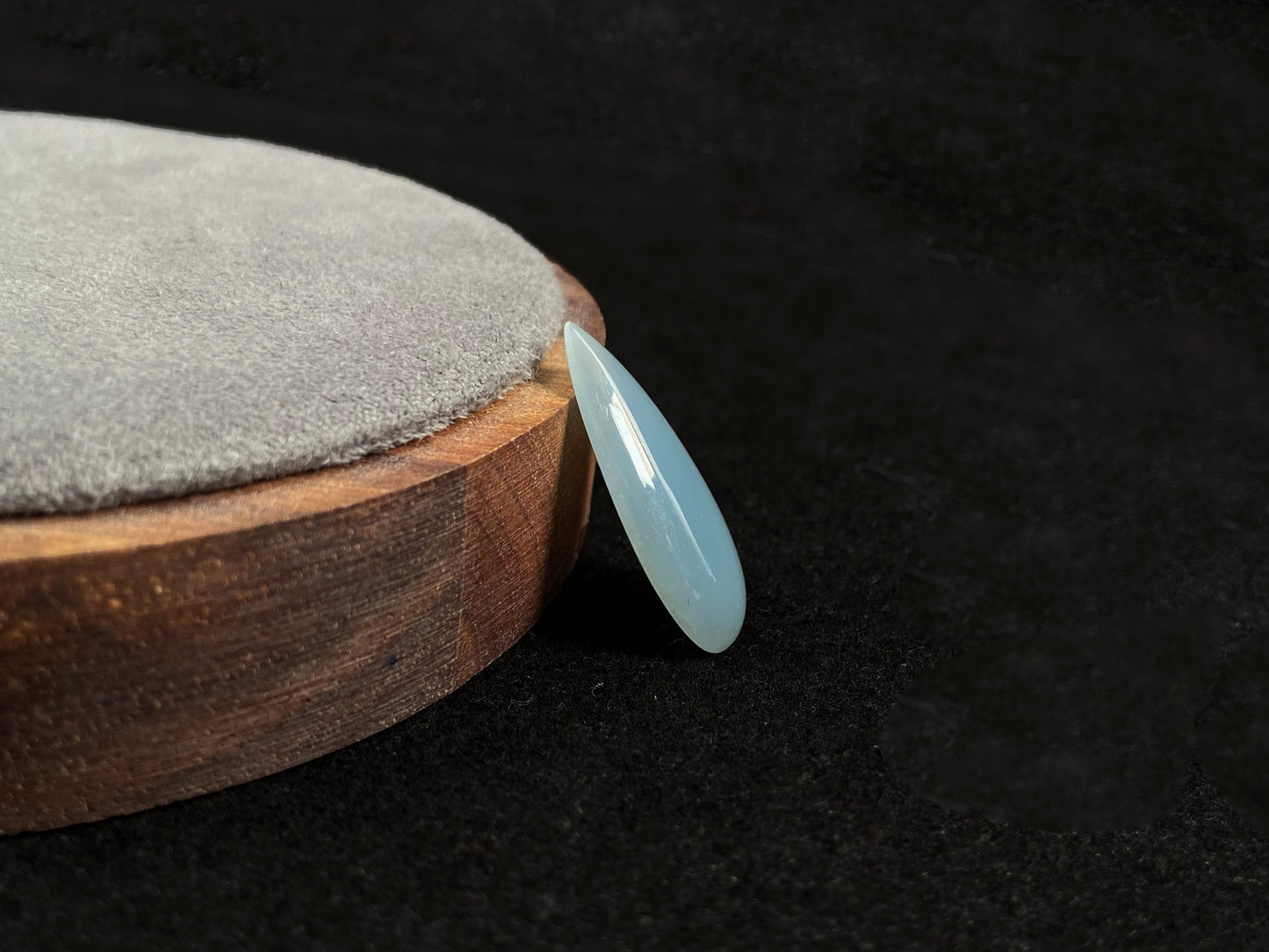 A blue, semi-transparent teardrop jadeite.
