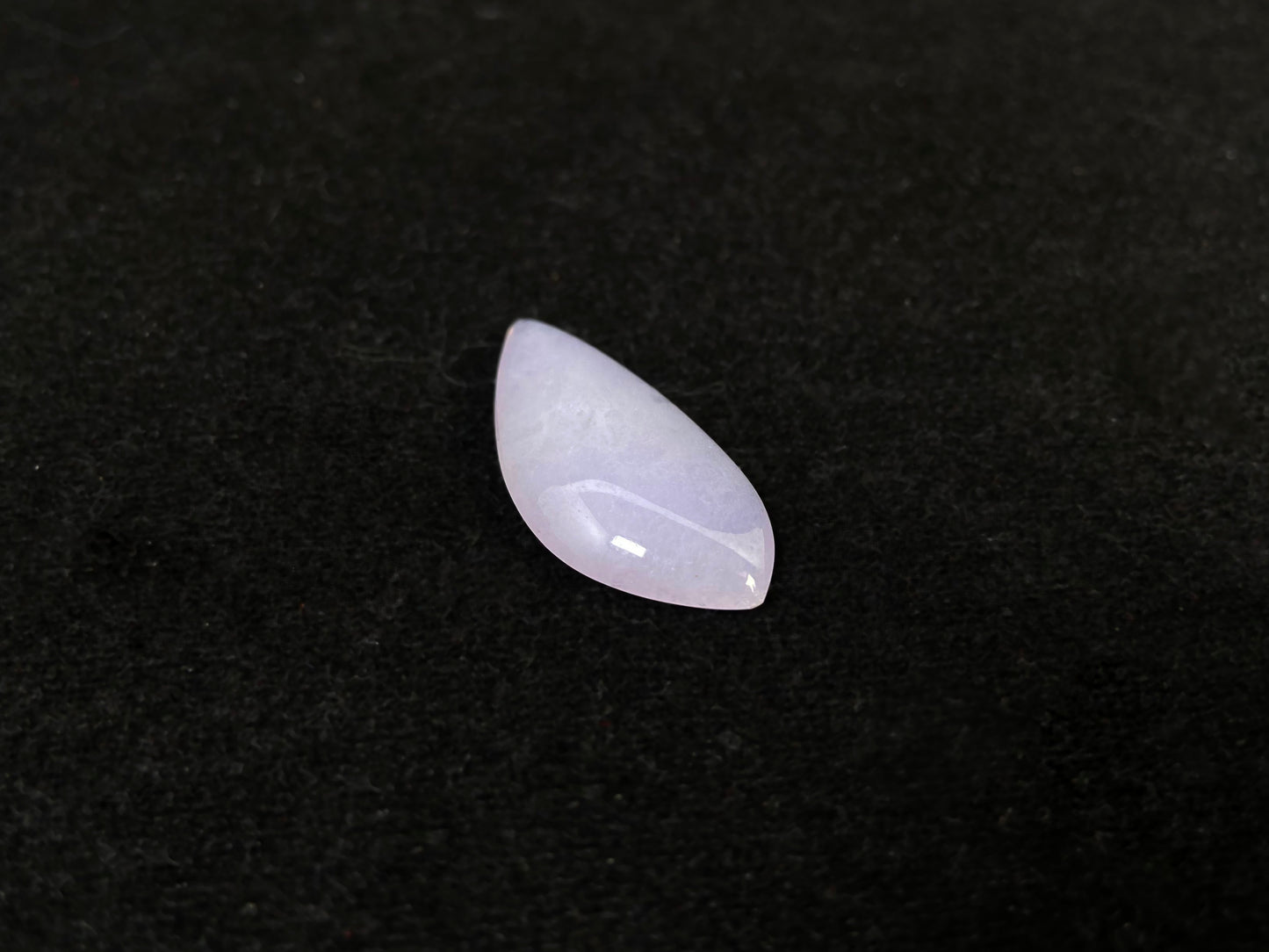 This lavender jade stone features a waterdrop shape.