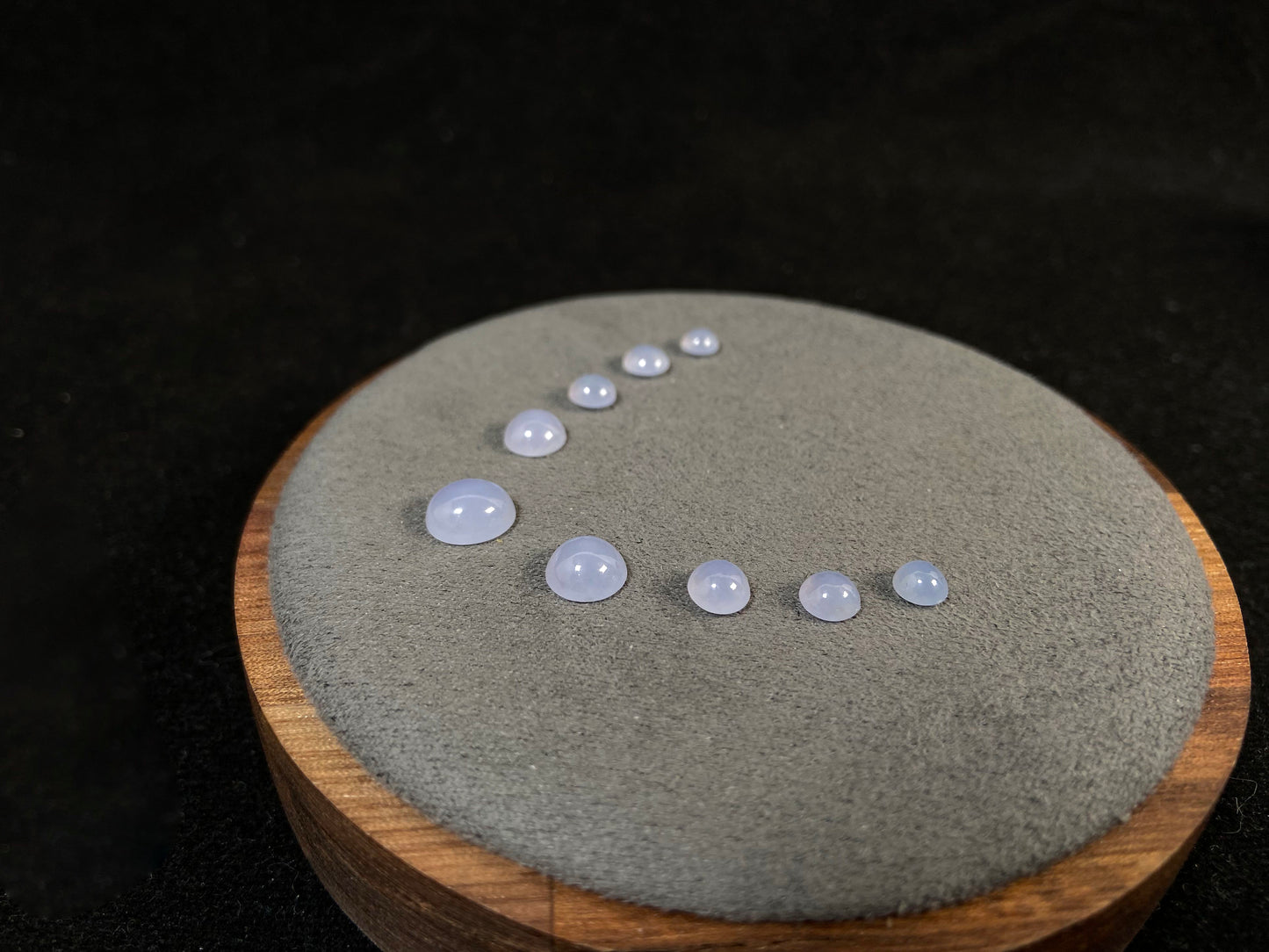 A lavender dewdrop nine stone set loose jadeite.