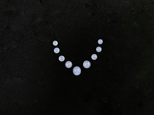 A lavender dewdrop nine stone set loose jadeite.