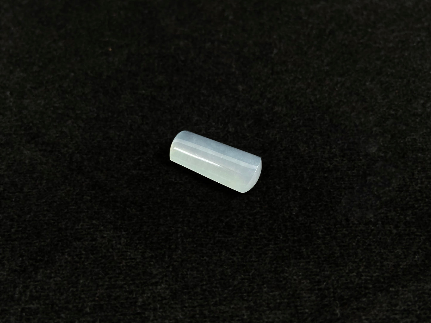 An icy smooth "Wu Shi Zhu" jadeite pillar.