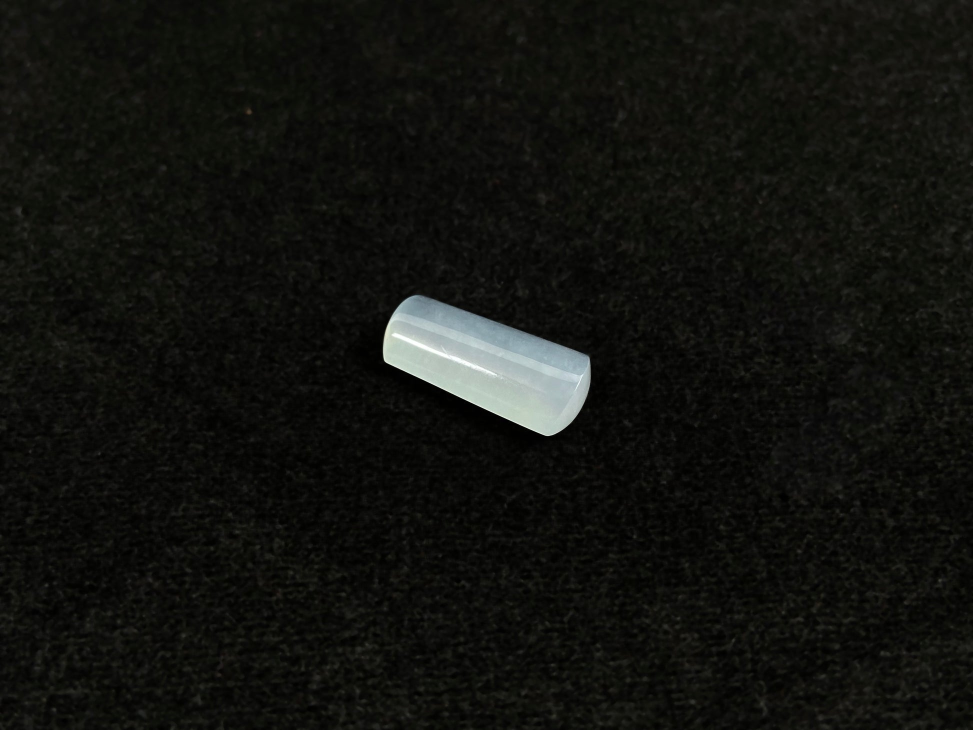 An icy smooth "Wu Shi Zhu" jadeite pillar.