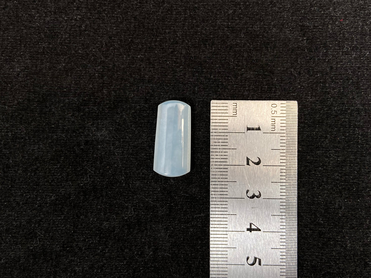 An icy smooth "Wu Shi Zhu" jadeite pillar.