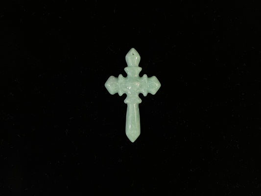 This is a pale green jadeite cross.