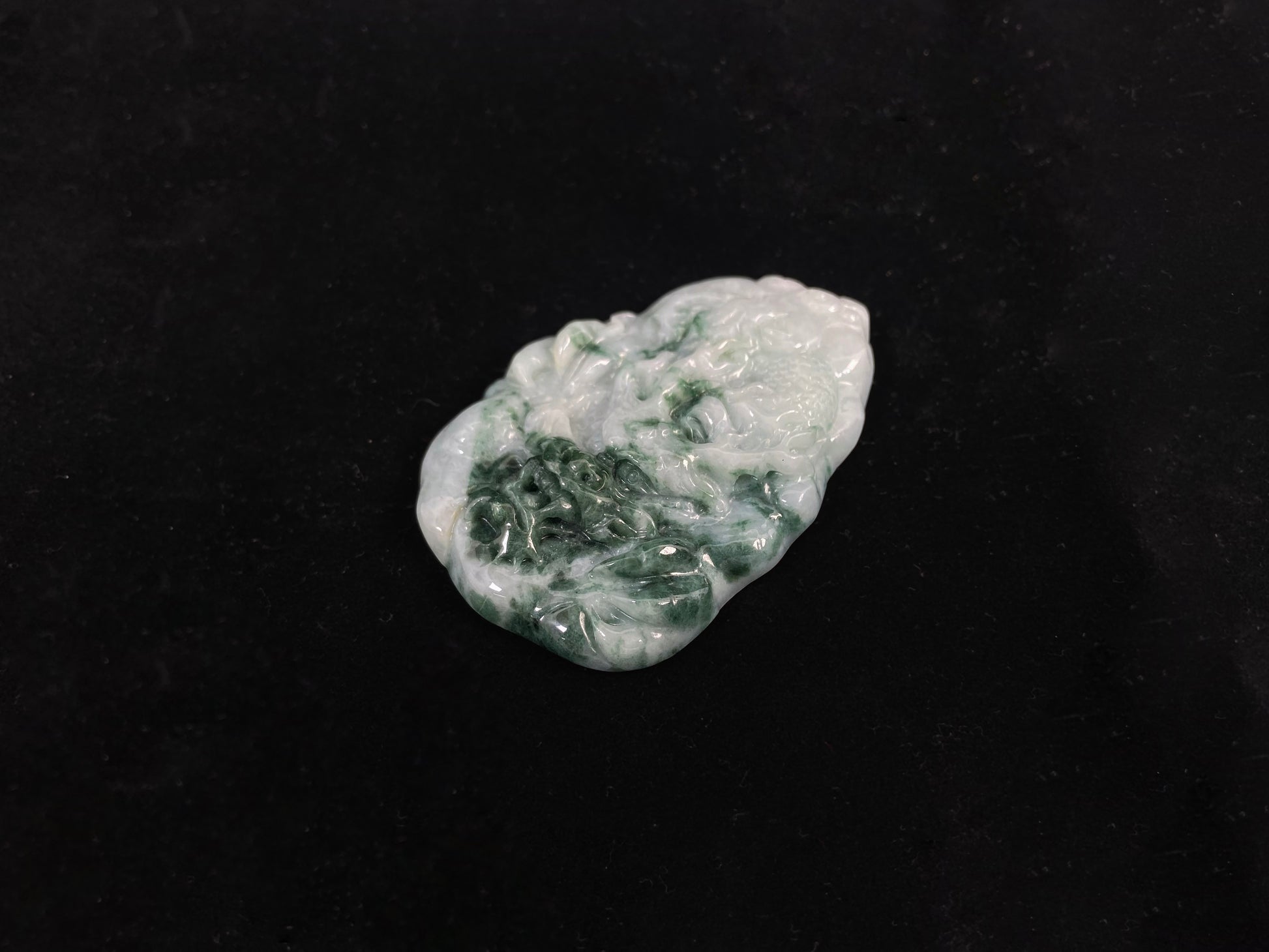 A milky white dragon with deep green accents.