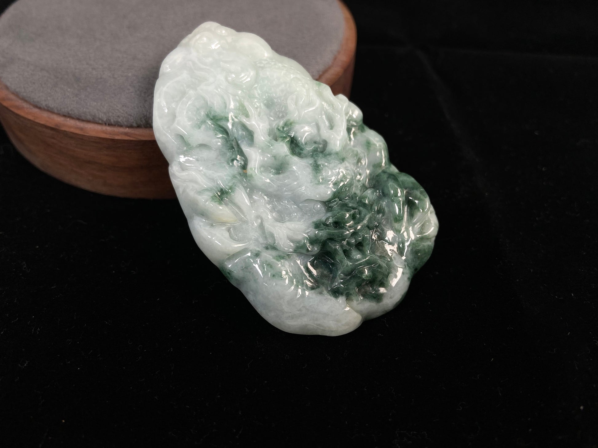 A milky white dragon with deep green accents.