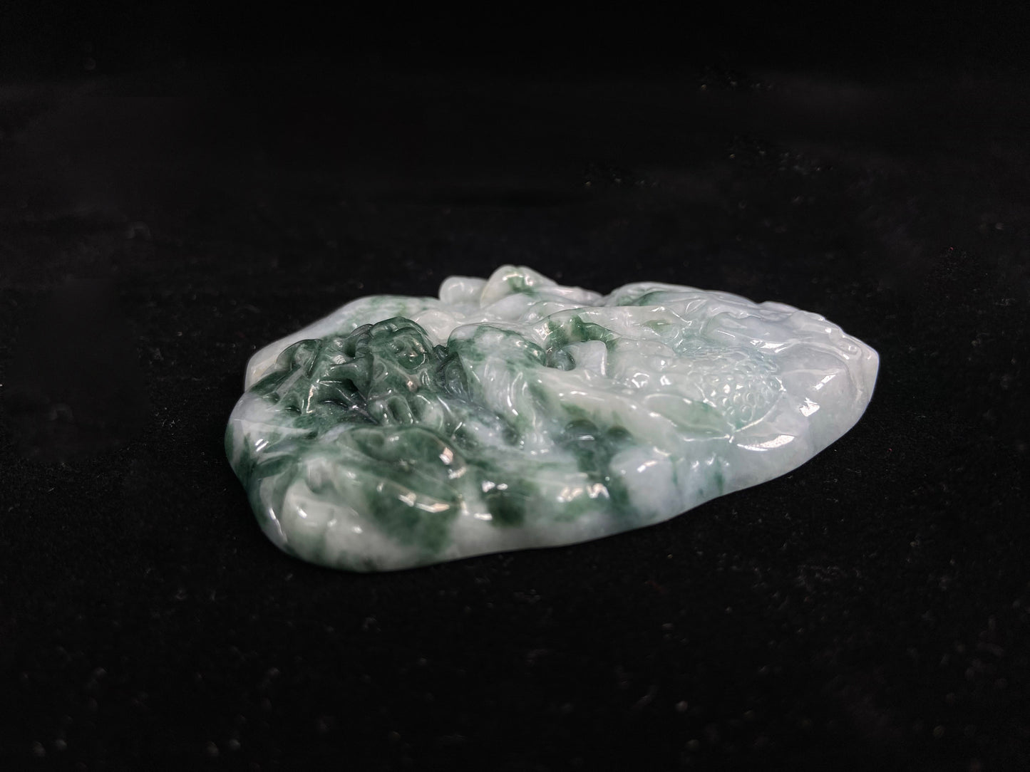 A milky white dragon with deep green accents.