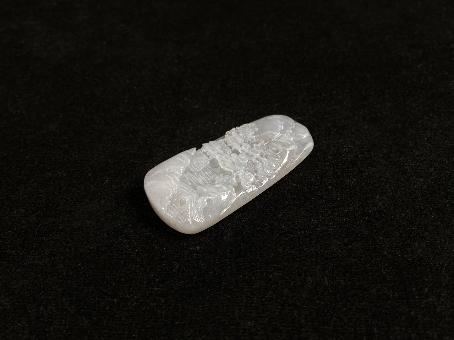 A icy white jadeite landscape plaque.