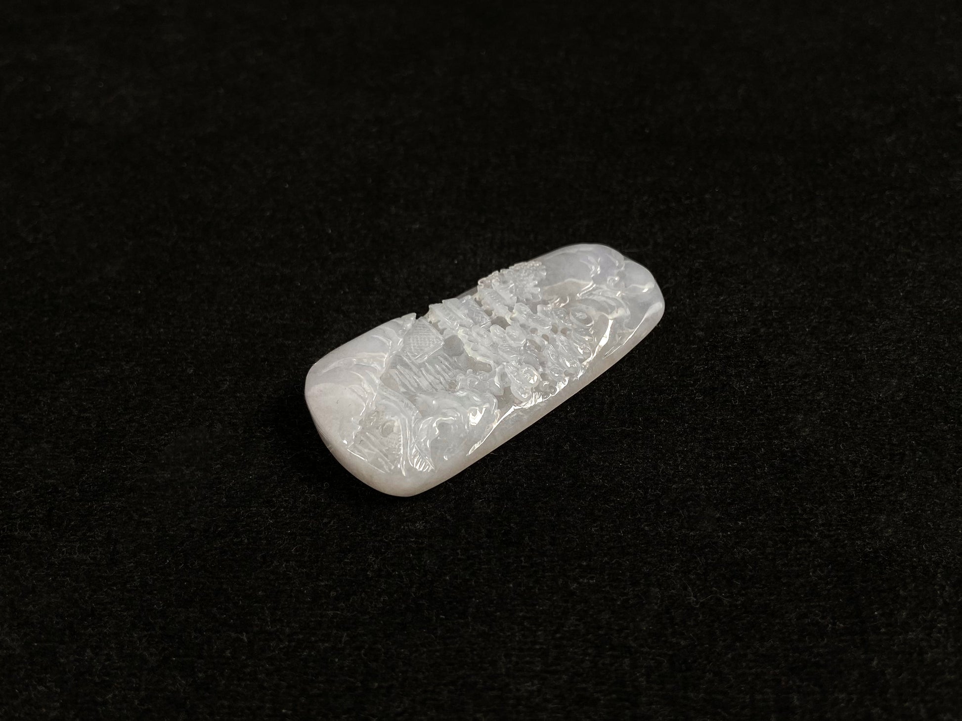 A icy white jadeite landscape plaque.