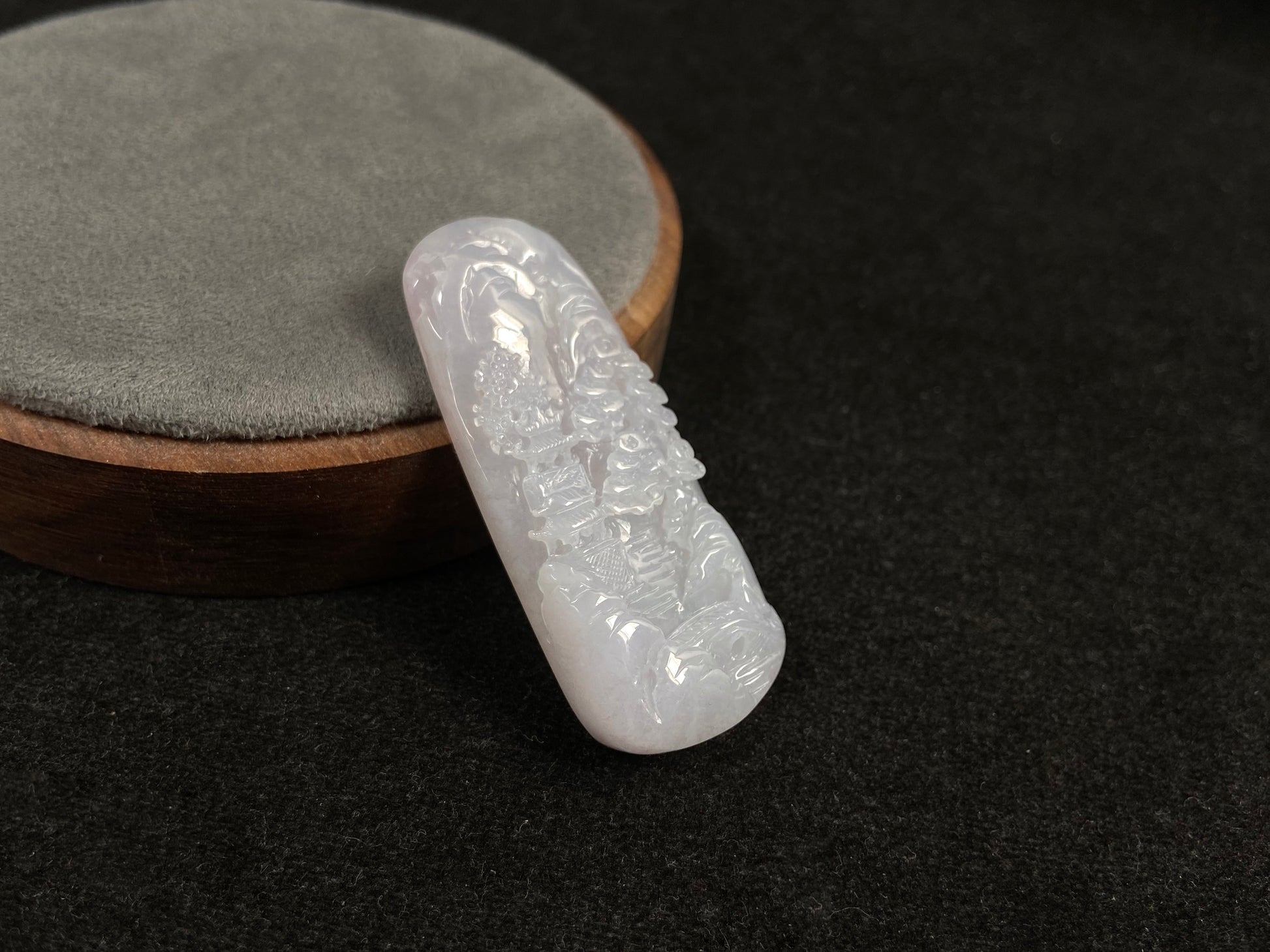 A icy white jadeite landscape plaque.