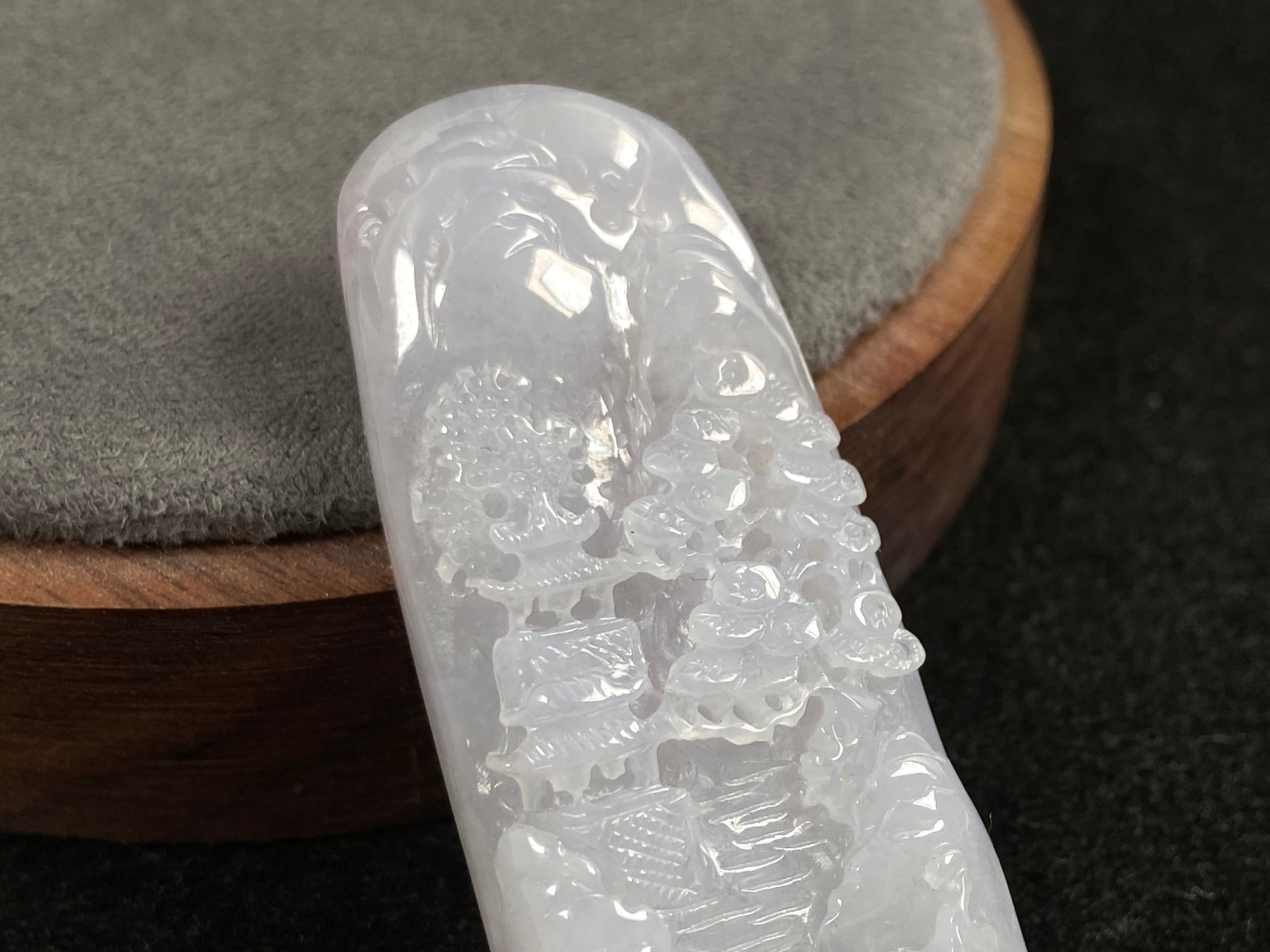 A icy white jadeite landscape plaque.