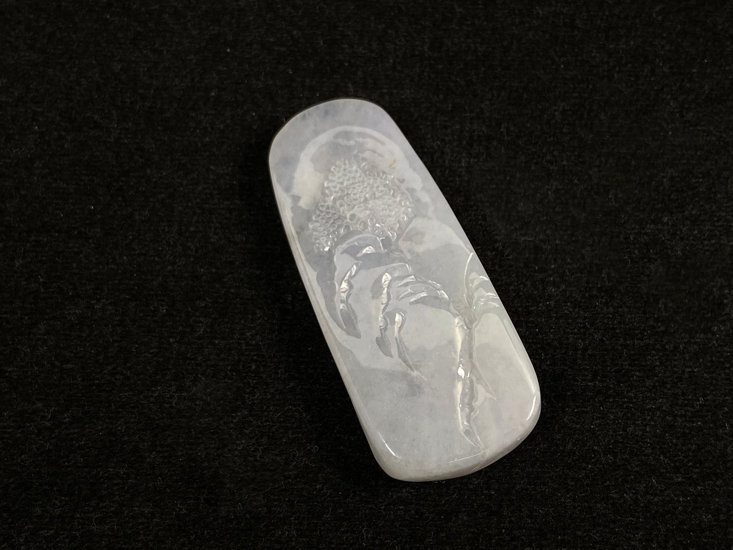 A icy white jadeite landscape plaque.