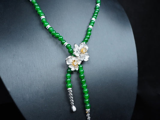 A lush green floral beads jadeite necklace.