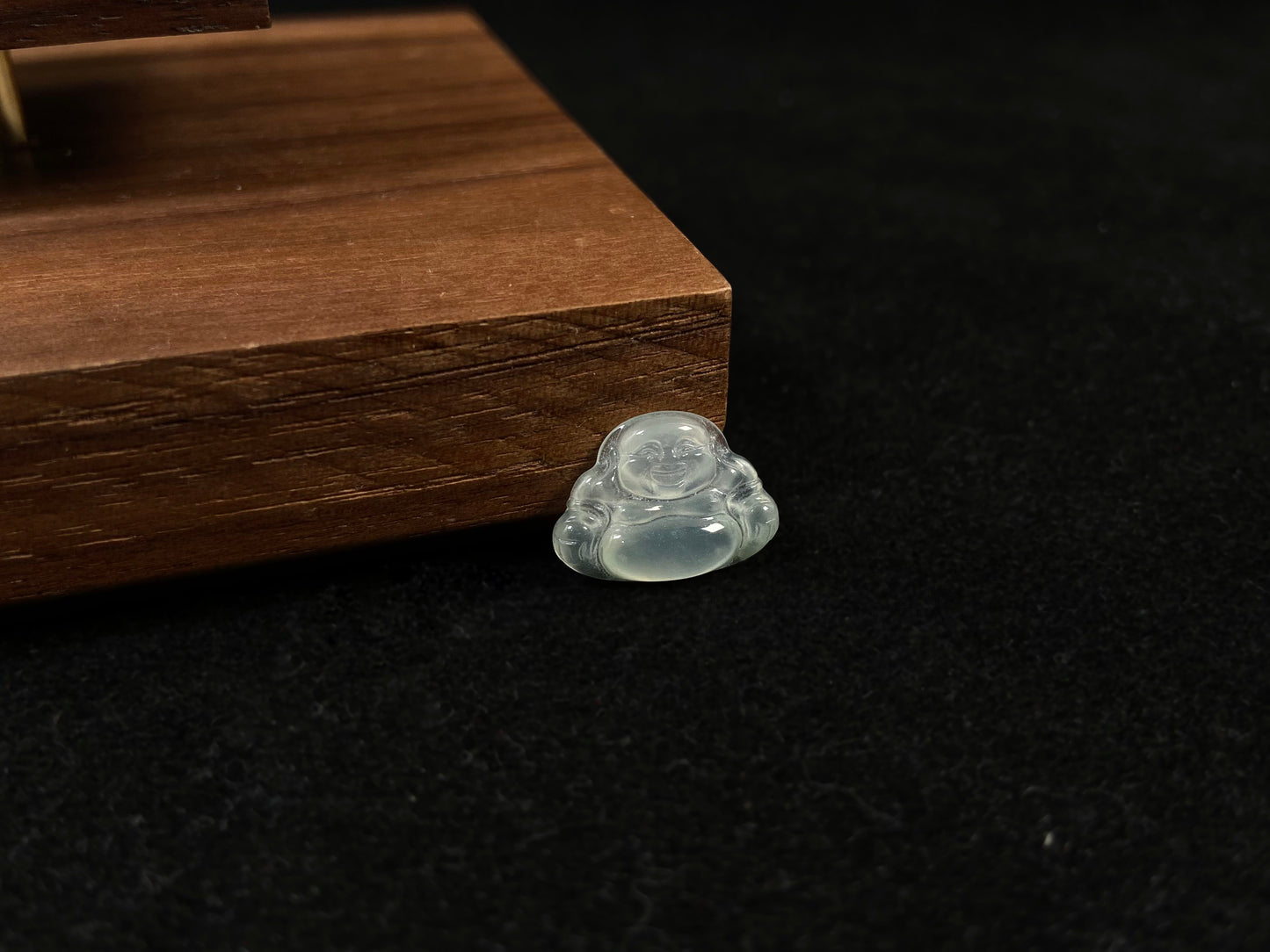 A transparent jade Buddha carving.