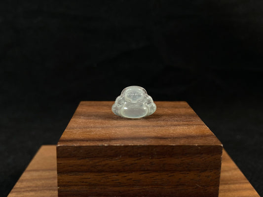 A transparent jade Buddha carving.