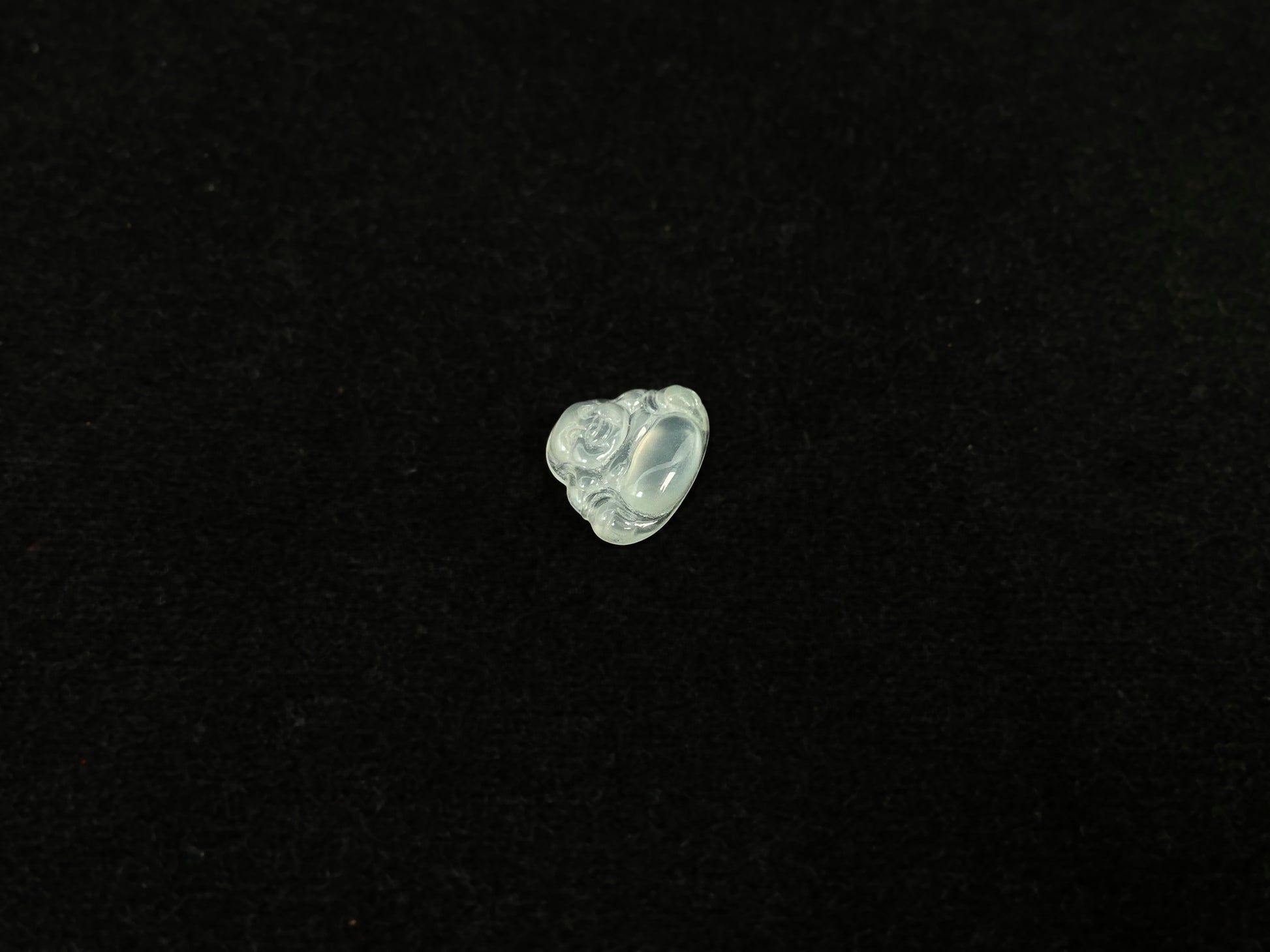 A transparent jade Buddha carving.