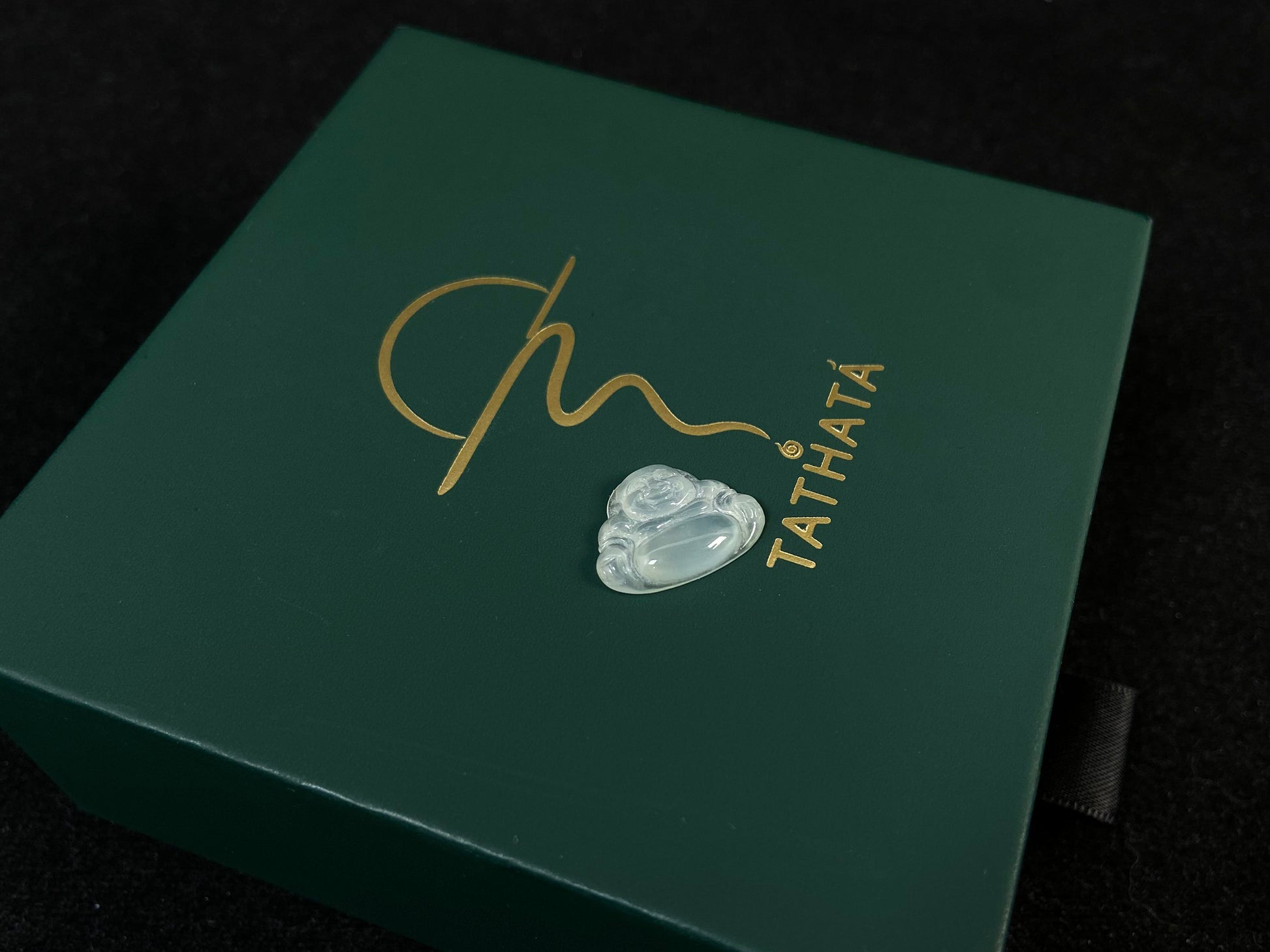 A transparent jade Buddha carving.