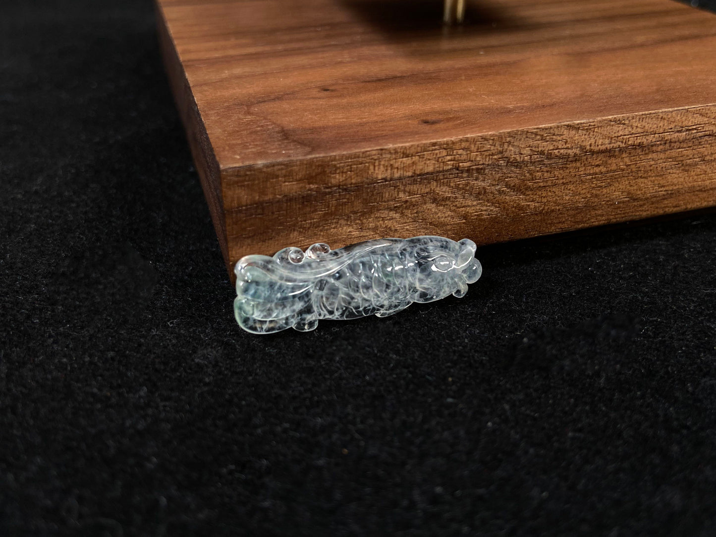 A white translucent jade koi carving.