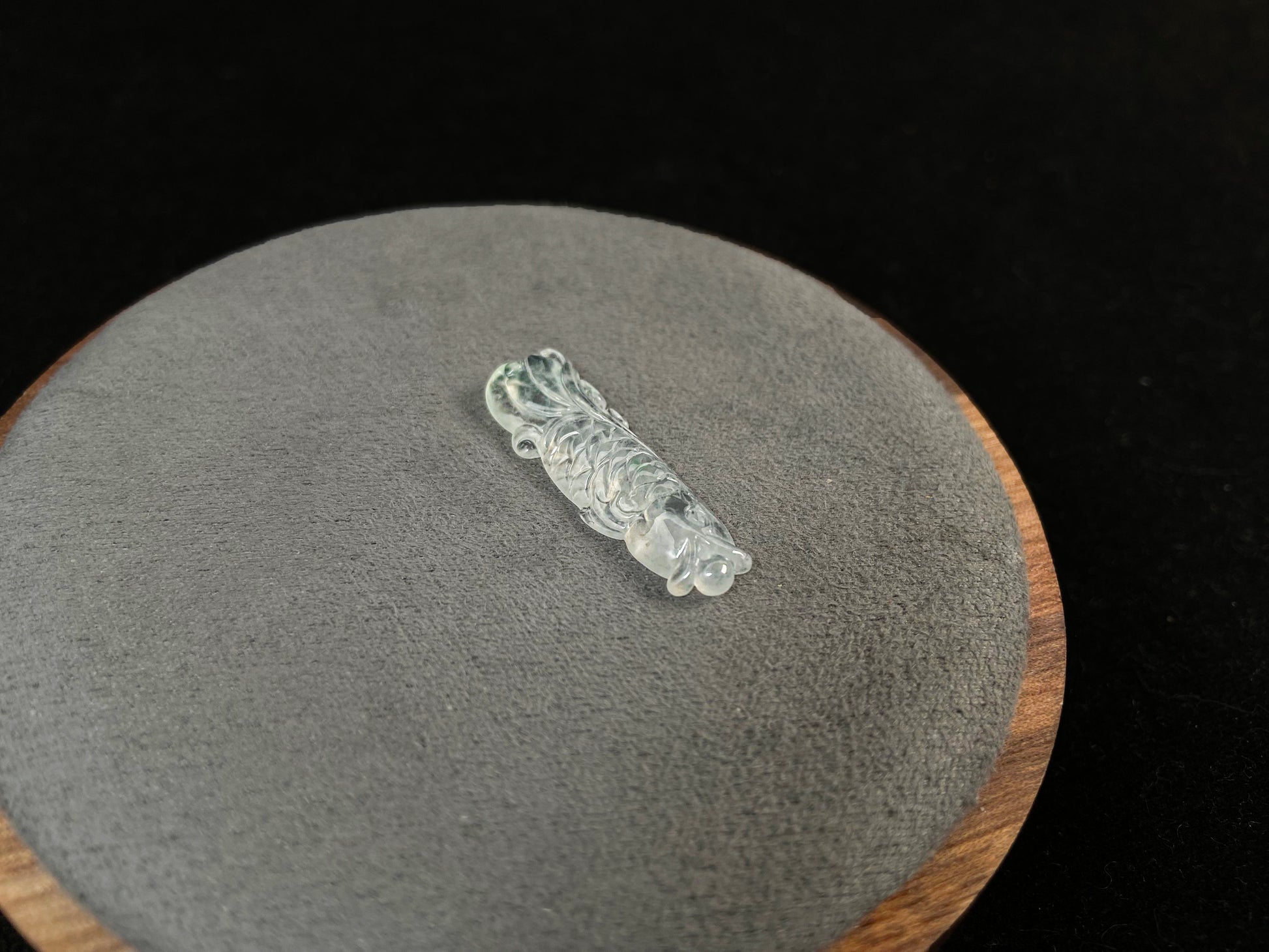 A white translucent jade koi carving.